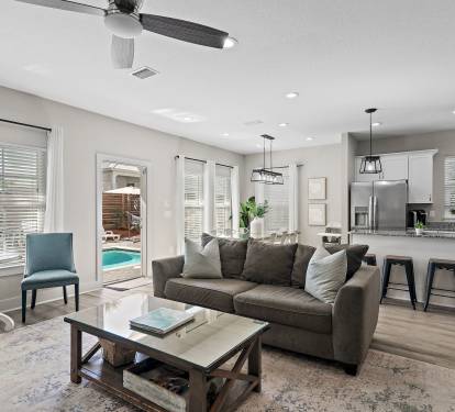 Living room opens directly to the pool area.