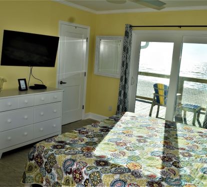 Master bedroom with in suite bathroom and deck acc
