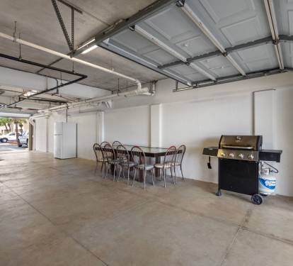 Garage With Plenty Of Seating, Grill, & Extra Fridge