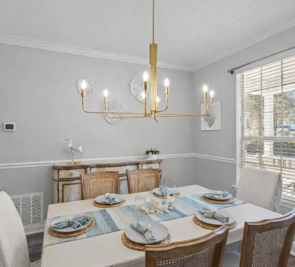 Coastal dinners, card games, or morning mimosas — the heart of the cottage is ready for memories.