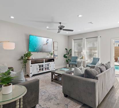 Relaxing living room with two comfortable sofa and a large 75" Smart TV.
