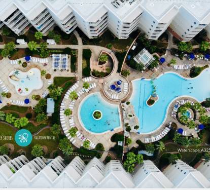 Birds-Eye view of the splash park, heated upper tiered pool, and zero entry pool