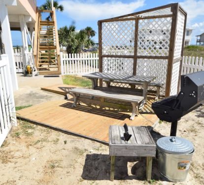 BBQ area with charcoal grill with lid