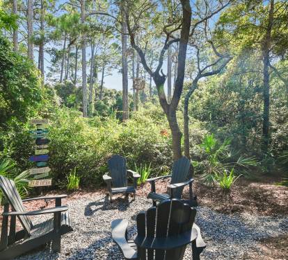 4 Adirondack Chairs - Beautiful wooded views with palms, trees and sounds of birds.