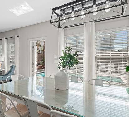 Custom glass dining table with seating for eight.