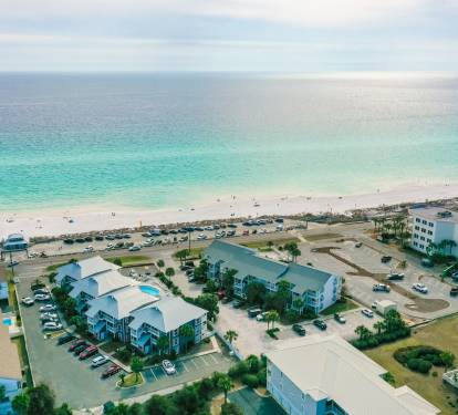 Small density complex - the row on the left is where the condo is located.  Across the street is the building for the Miramar Beach facilities...You're just steps away from a perfect beach day where you can come and go with ease. 