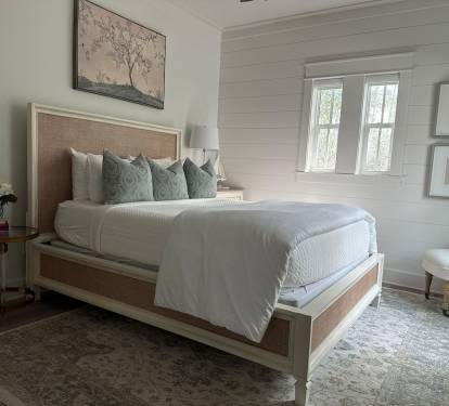 Spacious 2nd level queen bedroom suite with full ensuite bathroom, tiled shower, and a large vanity.