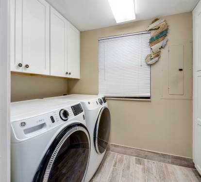 Laundry room with full size washer and dryer