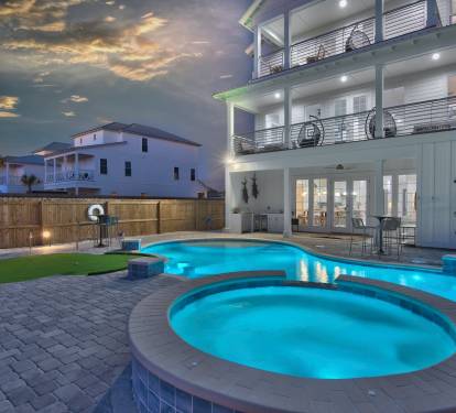Large hot tub with waterfall
