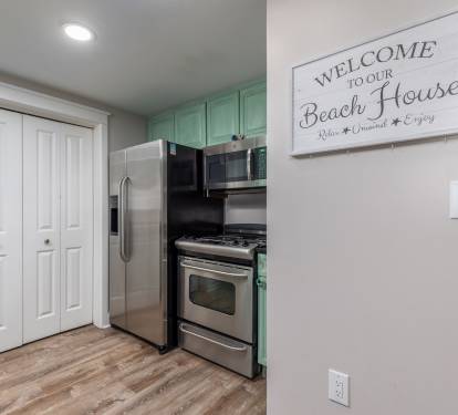 Stocked kitchen with upgraded dishes and full sized fridge. Microwave/stove/oven