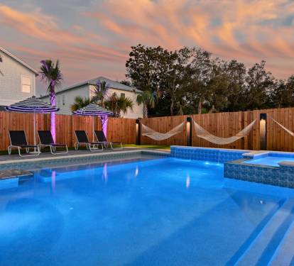 Sensational Resort Pool with a Large Hot Tub, Tanning ledge, Waterfalls, and an In-Pool Dining Table

