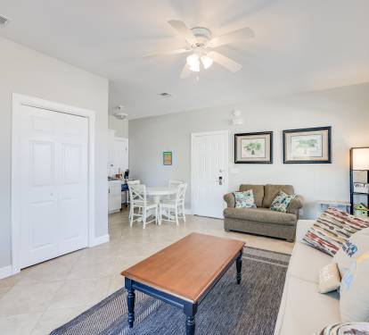 In Law living room with kitchenette and dining seating for four.