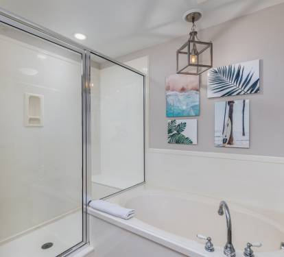 Over sized tub and shower with bench. 