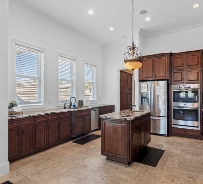 Kitchen island with prep sink and ample workspace