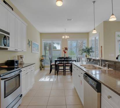 kitchen features granite counter tops and stainless appliances