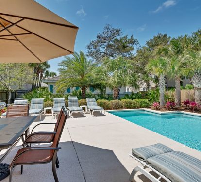 propane grill, patio set and lounge chairs for enjoying the back yard!