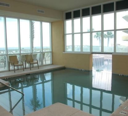The indoor pool with a swim through window to the outdoor pool.