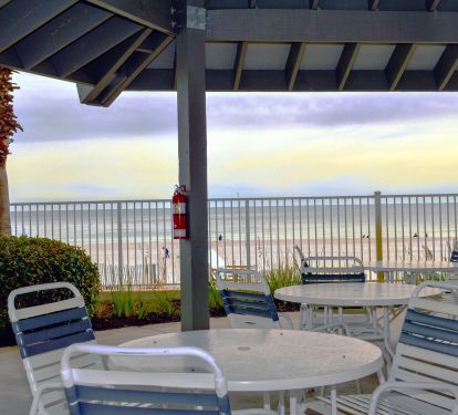 A covered beach front patio with restrooms. Perfect for watching the waves!