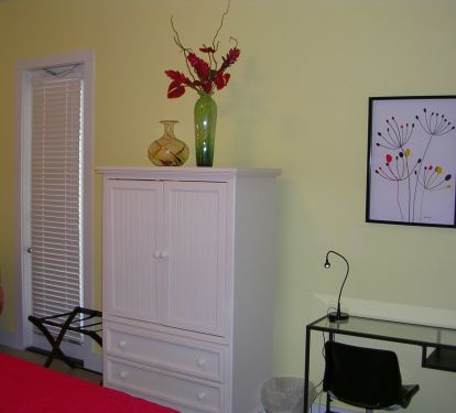 Large flat screen tv in armoire in first floor bedroom