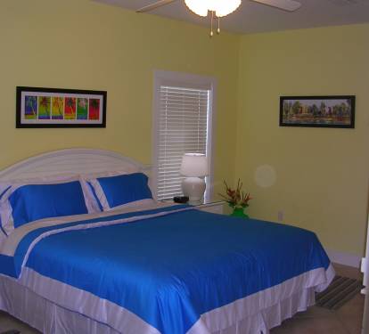 Upstairs guest bedroom features a king bed and attached bath