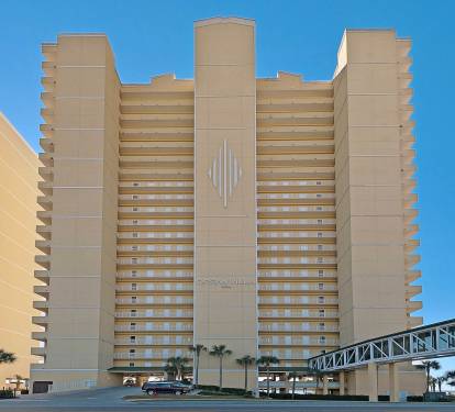 View of the Building with Parking Garage and Pedestrian Bridge