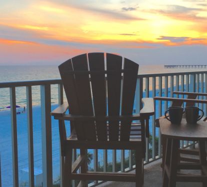 This chair is waiting for you!  Great place to watch the sunset or the activity on the beach