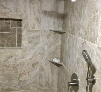 Newly finished walk in shower with waterfall and hand held shower
