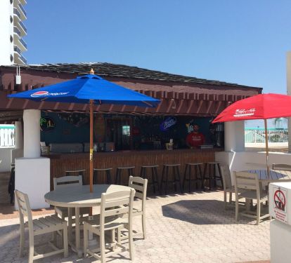 Tiki Hut by the pool serving food and drinks. "Seasonal"