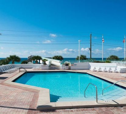 Large heated pool. Chaise lounge chairs .Also an area where  you can sunbathe, read a book, listen to music, or just enjoy listening to the surf. Also a kiddie pool