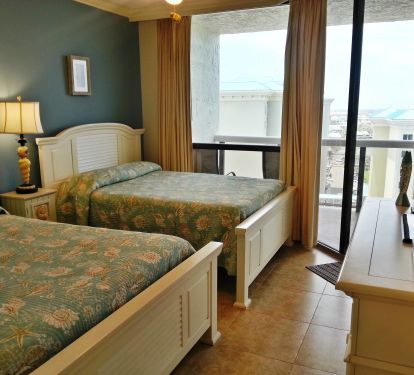 Guest Bedroom 2 full beds , flatscreen TV, DVD player, celing fan, closet, All Linens are supplied. Balcony access.