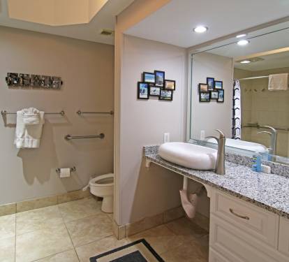 Large Master bathroom with roll-under sink access.