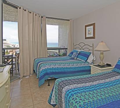 2nd bedroom has 2 queen beds, balcony access, flat screen TV, ceiling fan