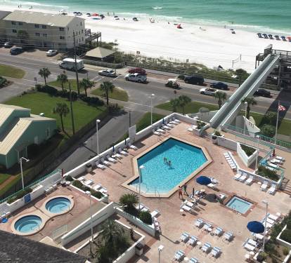 Balcony view of the spacious pool deck and skybridge over to the beach tower.