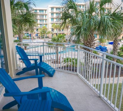 Side view from the large balcony overlooks the lazy river ride and main pool.