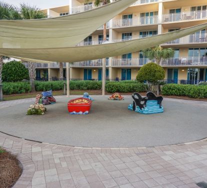 Rubber floor play area that is shaded.