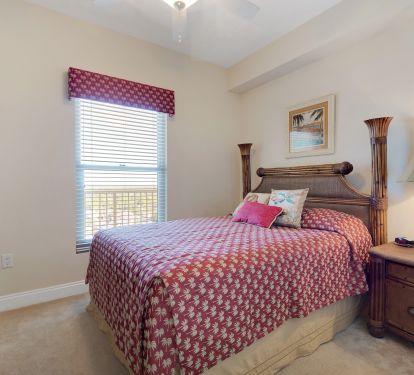 The large 2nd bedroom with Queen bed, large closet, and 4-piece en-suite bathroom