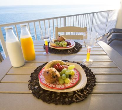 Enjoy a meal from this breathtaking balcony view!