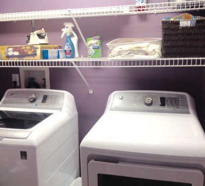 Full size laundry room with new high efficiency washer and dryer 