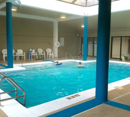 Heated indoor pool with glass roof.  Area also includes hot tub and sauna