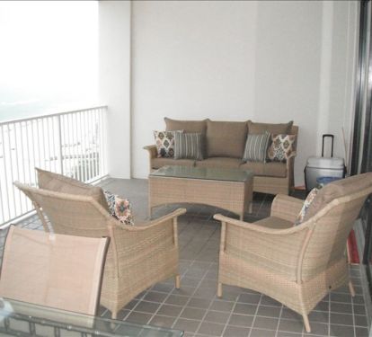 HUGE Balcony with large dining table and outdoor lounge furniture