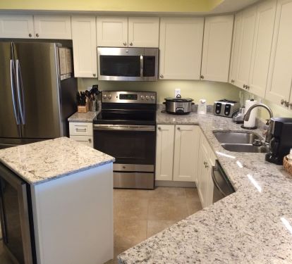 Kitchen-stainless appliances, beverage fridge in island, granite countertops