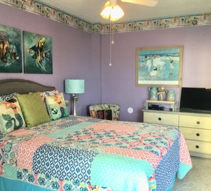 Queen Bedroom opens onto small private balcony with seating for two