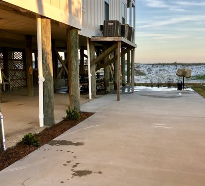 Ground level has gaming area, bbq grill, and a table/chairs under the house