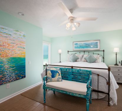 Master bedroom with king bed and sliding doors onto the deck