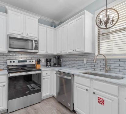 Kitchen stove, oven, microwave, dishwasher, and sink