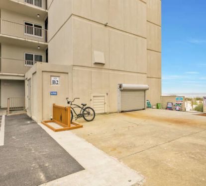 Front door to beach path opening on right side of photo.
