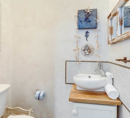 Powder room just off the dining space