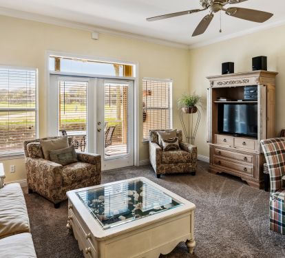Spacious living room leads out to large screened in porch
