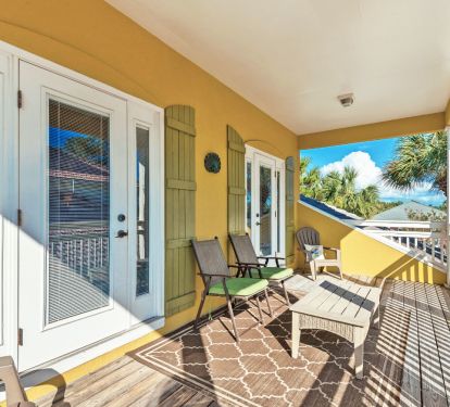 Covered balcony porch accessed from either upstairs bedroom.