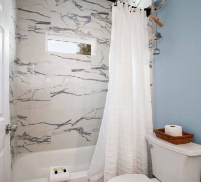 1st floor ensuite bath with double vanity and tub/shower combo.